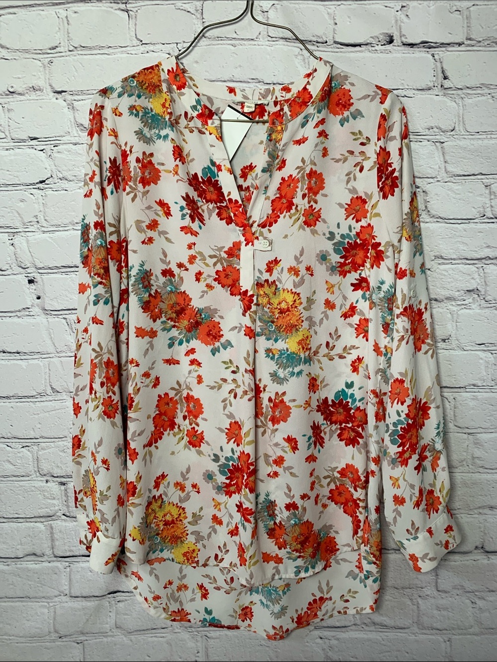Pleione Cream Floral V-Neck Blouse with Red and Teal Accents